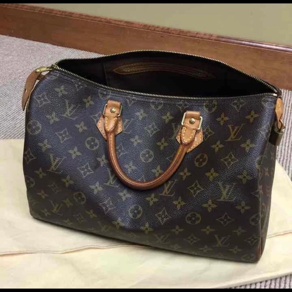 LV hot stamp on Monogram Empreinte Speedy